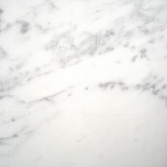 Carrara marble texture with white background and grey veining, displaying irregular swirling patterns and a polished sheen, horizontally bisected.